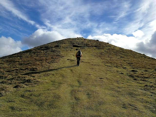 Training for the Camino de Santiago by walking with a loaded backpack on hilly terrain