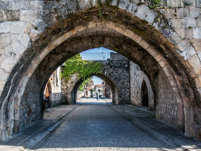 A medieval archway along the Camino, where pilgrim hospitals once offered free shelter to travellers
